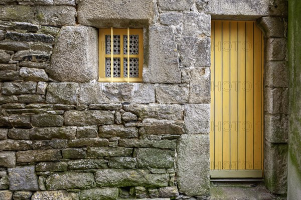 House facade with yellow door and yellow windows, Roscoff, Finistere, Brittany, France, Europe