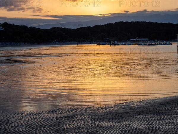 Morning atmosphere on the beach at sunrise, Lopar, island of Rab, Kvarner Gulf Bay, Croatia, Europe