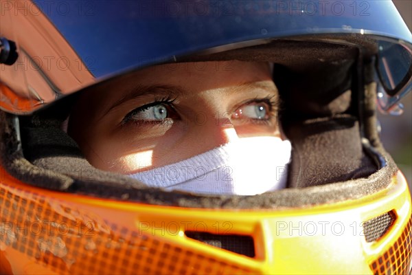 Symbolic image: Racer with helmet and balaclava