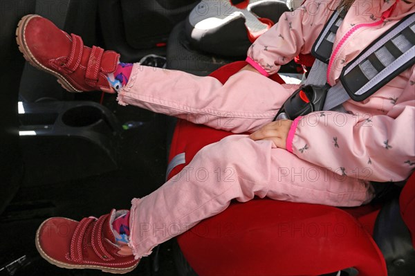 Infant strapped into the car