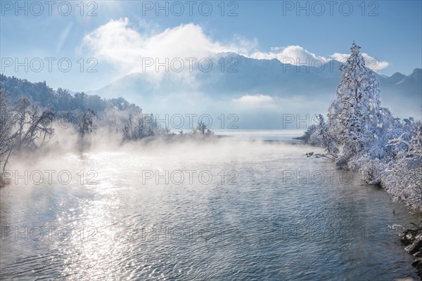Winter landscape with outflow of the Loisach from the Lake Kochel in front of the Herzogstand 1731m, Kochel am See, Das Blaue Land, Bavarian Alps, Upper Bavaria. Bavaria, Germany, Europe
