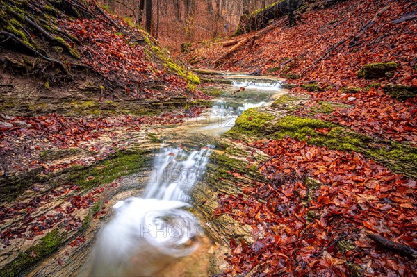 Waterfall in the Rautal forest in Jena in winter, Jena, Thuringia, Germany, Europe