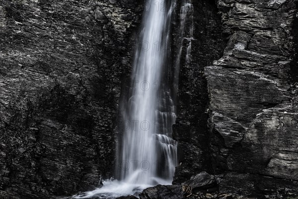 Waterfall in the mountains, environment, pure, clear, clean, nature, idyll, idyllic, flowing, ecology, ecological, puristic, mountain stream, slate, stone, structure, black, grey, monochrome, force of nature, Valais, Switzerland, Europe