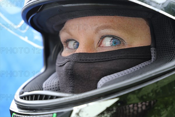 Racer with helmet and balaclava