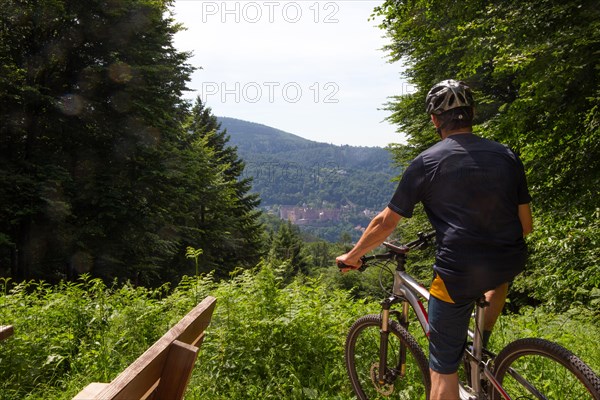 Mountain biker enjoys the view of Heidelberg Castle