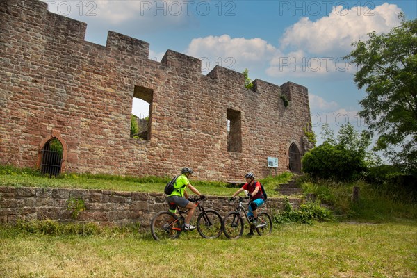 Mountain bikers take a break at the Wolfsburg above Neustadt in the Palatinate Forest, Germany, Europe