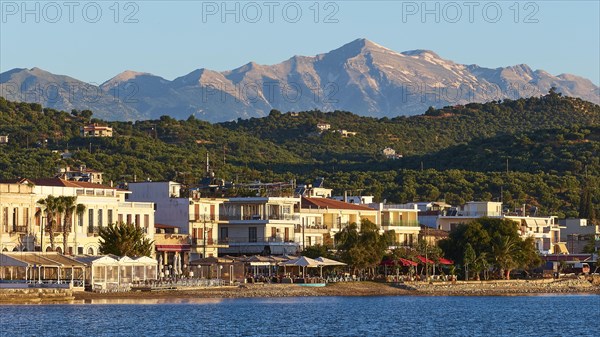 Coastal town at sunrise with a view of the sea and mountains in the background, Taygetos Mountains, Taygetos, Gythio, Mani, Peloponnese, Greece, Europe