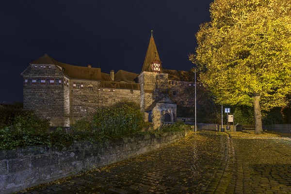 Wenzelburg or Lauf Imperial Castle illuminated at night on a rainy autumn day, rebuilt by Emperor Charles IV in 1556, Schlossinsel 1, Lauf an der Pegnitz, Middle Franconia, Bavaria, Germany, Europe