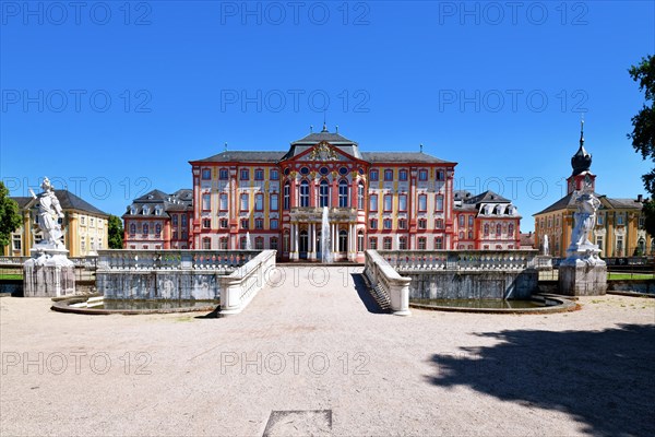 Bruchsal, Germany, August 2023: Baroque castle called Bruchsal Palace with fountain on sunny day, Europe