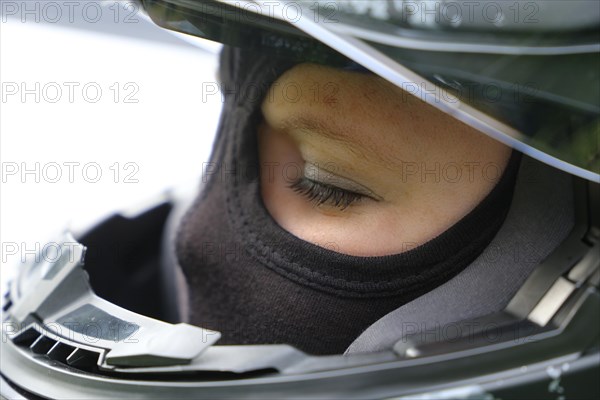 Racer with helmet and balaclava