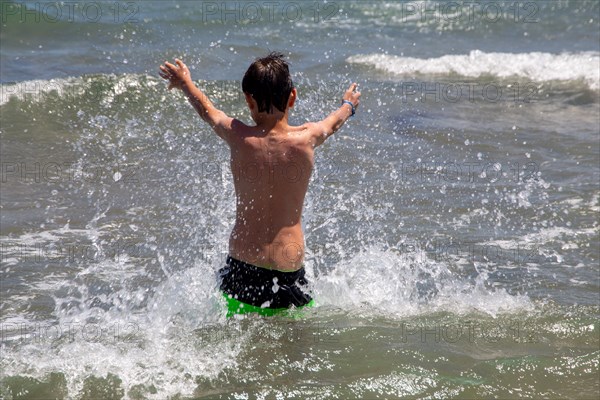 Boy has fun in the sea