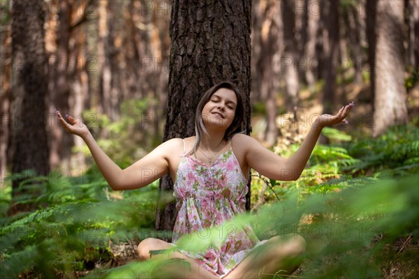 Young woman bathing in the forest (Shinrin Yoku), nature therapy from Japan