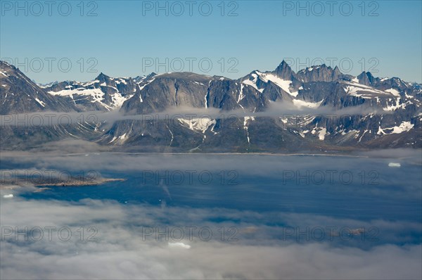 Iceberg, ice and islands, in a fjord, aerial view, rough, snow-covered rough, snow-covered mountain landscape, aerial view, South Greenland, Nanortalik, North America, Greenland, Denmark, North America