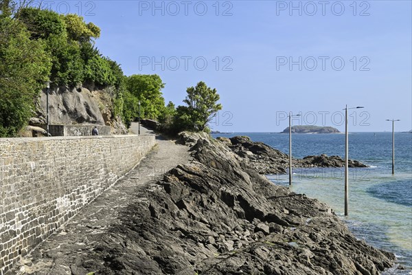 Fortified coast with paths on the rocky shore in Dinard, Ille-et-Vilaine, Brittany, France, Europe