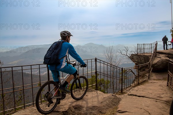 Mountain bikers on the viewing platform at Orensfels, Palatinate Forest