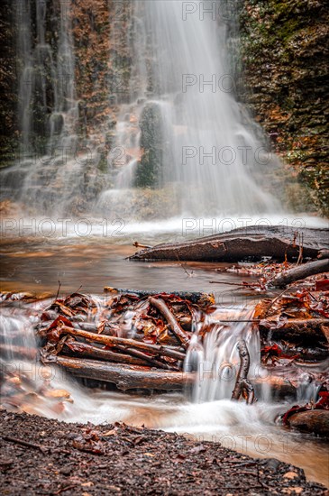 The waterfall in the Rautal forest at Burschenplatz in winter, Jena, Thuringia, Germany, Europe