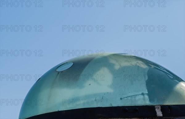 Plexiglass dome covering the slewing sight on battleship gun fire-control system on display public park