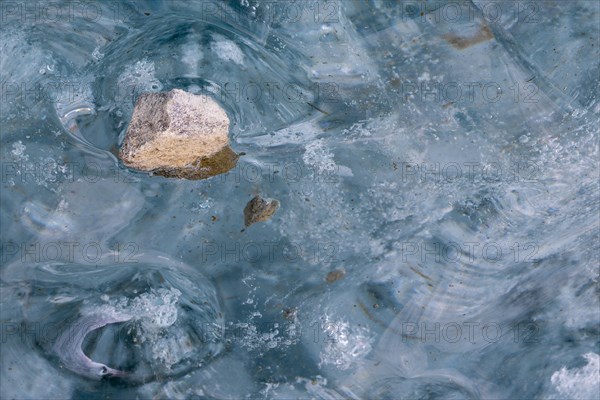 Trapped stone in an ice structure, glacier cave, winter, Morteratsch glacier, Pontresina, Engadine, Grisons, Switzerland, Europe