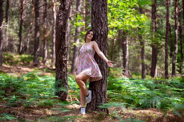 Young woman bathing in the forest (Shinrin Yoku), nature therapy from Japan