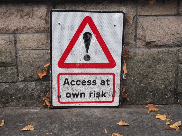 Access at own risk sign