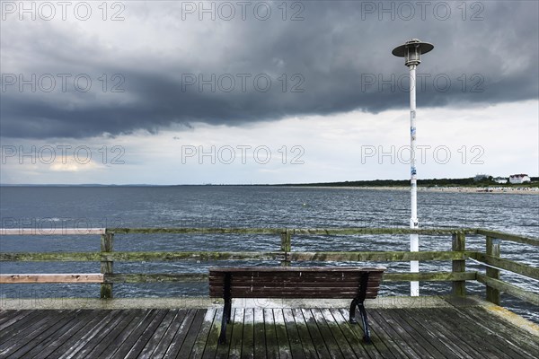 Bench on a dilapidated jetty on the Baltic Sea coast, sea, Baltic Sea, holiday, gloomy, depressive, nobody, empty, stormy, bad weather, cloudy, clouds, rain clouds, view, mood, atmosphere, Germany, Europe