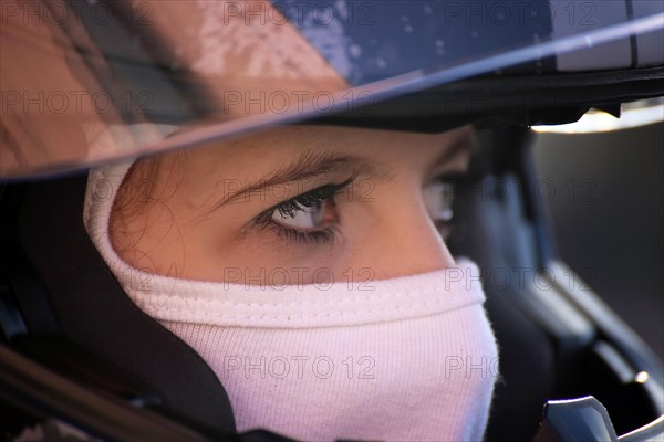 Racer with helmet and balaclava