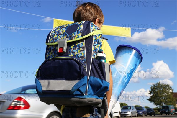 Child on the way to his first day of school, (Mutterstadt, Rhineland-Palatinate)