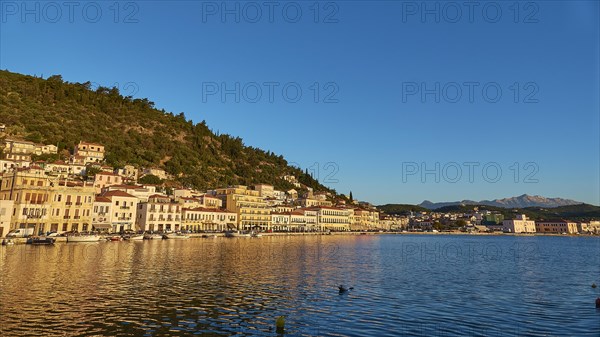 The blue hour brings peace to the coastal landscape and is reflected in the calm sea, Taygetos Mountains, Taygetos, Gythio, Mani, Peloponnese, Greece, Europe