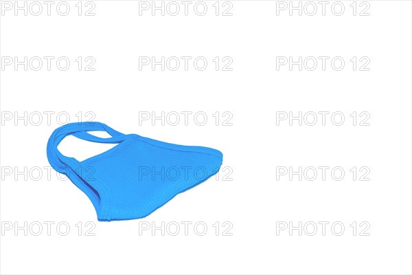 Folded blue health mask isolated on clean white background