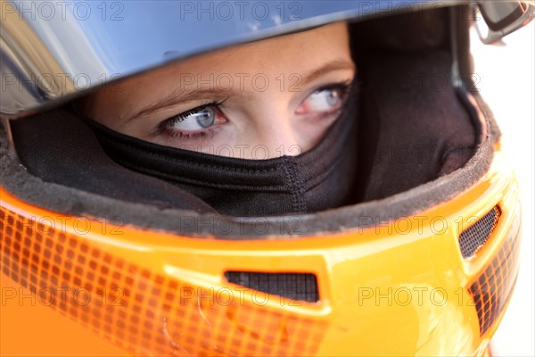 Racer with helmet and balaclava