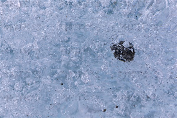 Trapped stone in an ice structure, glacier cave, winter, Morteratsch glacier, Pontresina, Engadine, Grisons, Switzerland, Europe
