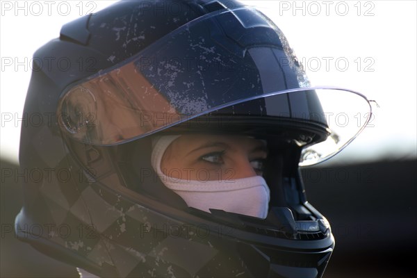 Racer with helmet and balaclava