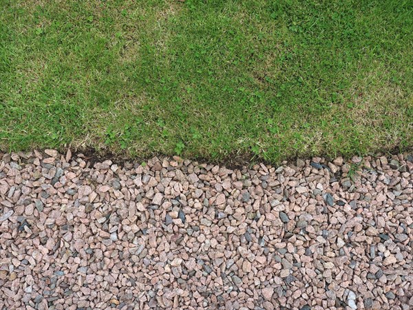 Green meadow and gravel background