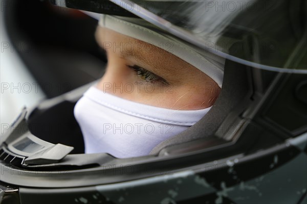 Racer with helmet and balaclava