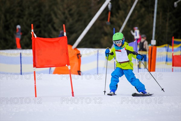 Child at a guest ski race in a ski resort