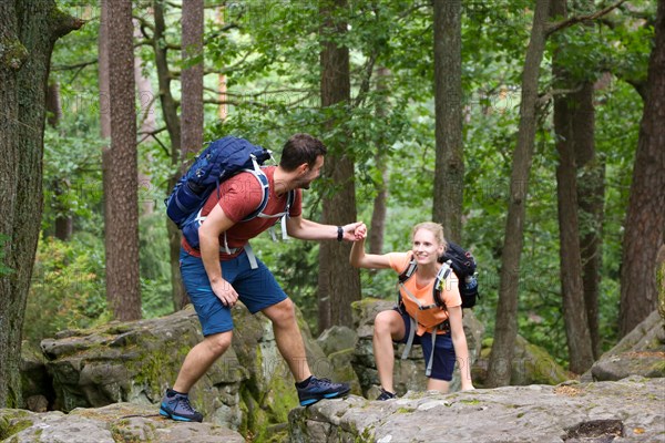 Symbolic image: Young couple hiking in the Palatinate Forest, here on the fifth stage of the Palatinate Wine Trail between Neustadt an der Weinstrasse and St. Martin