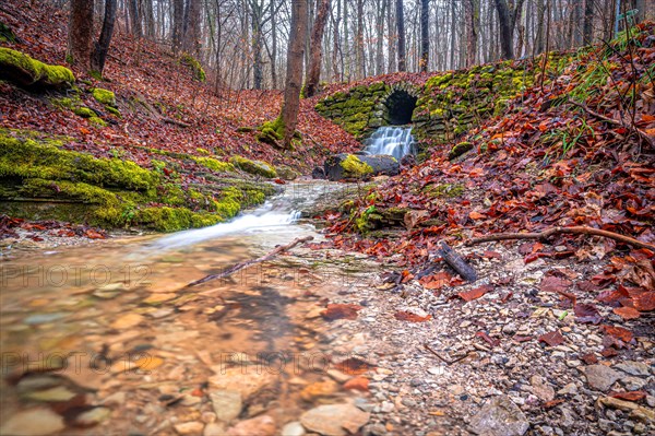 Waterfall in the Rautal forest in Jena in winter, Jena, Thuringia, Germany, Europe