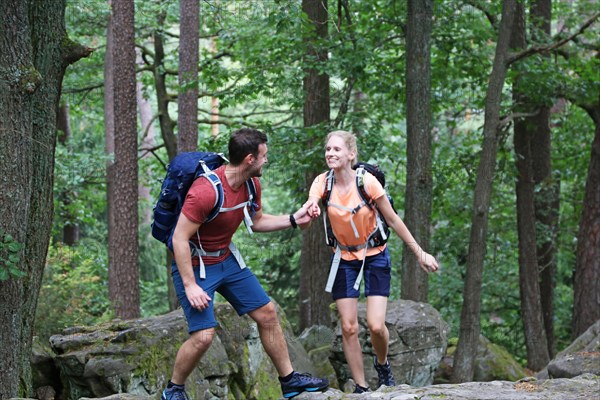 Symbolic image: Young couple hiking in the Palatinate Forest, here on the fifth stage of the Palatinate Wine Trail between Neustadt an der Weinstrasse and St. Martin