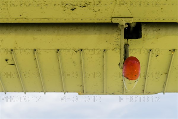 Counter weight on flap hinge of old antique airplane