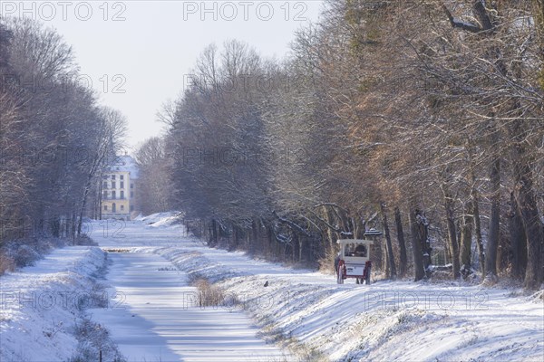 Carriage ride along the canal between the hunting lodge and the Fasanenschloesschen, Moritzburg, Saxony, Germany, Europe