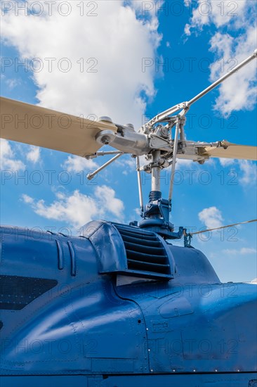 Cowling and rotor assembly on helicopter with blue cloudy sky in background in Seosan, South Korea, Asia