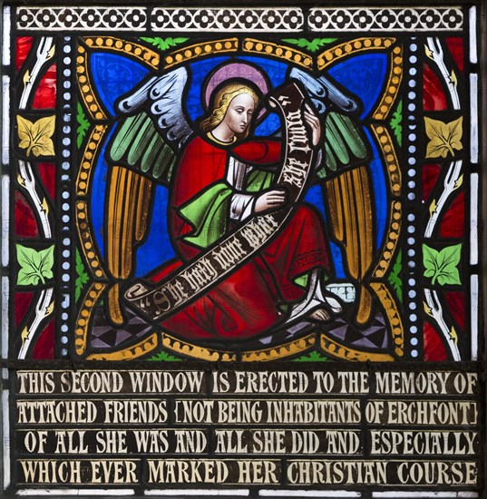 Victorian stained glass window detail depicting an angel holding memorial banner circa 1858 by William Wailes (1808-1881), Urchfont church, Wiltshire, England, United Kingdom, Europe