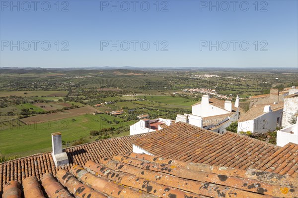 Historic walled hilltop village of Monsaraz, Alto Alentejo, Portugal, southern Europe view over rooftops north over countryside fields, Europe