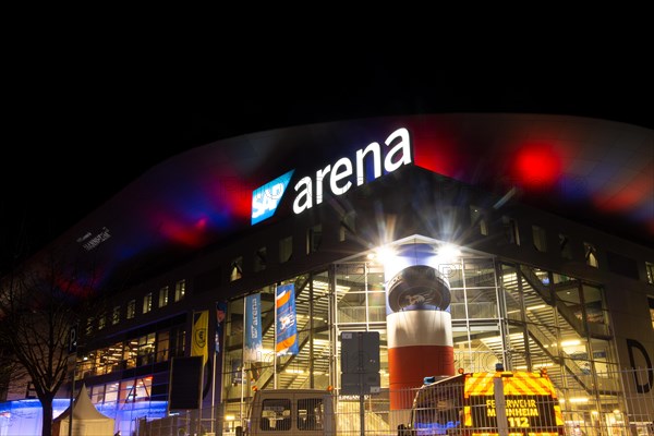 Night shot of the brightly lit SAP Arena in Mannheim at an Adler Mannheim home game