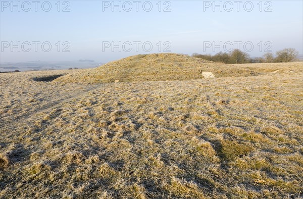 Bronze Age bowl barrow on Windmill Hill, a Neolithic causewayed enclosure, near Avebury, Wiltshire, England, UK