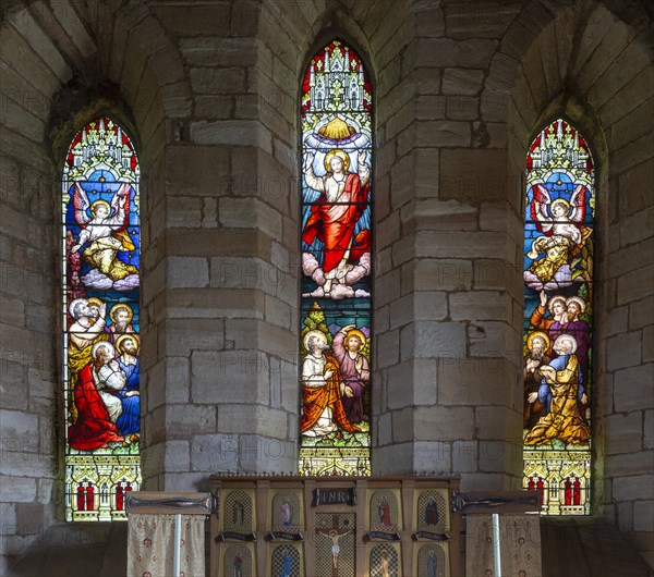 Stained glass east window church of Saint Mary the Virgin, Holy Island, Lindisfarne, Northumberland, England, UK