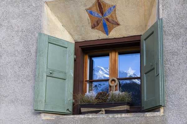 Windows on historic house, sgraffito, facade decorations, shutters, Guarda, Engadin, Grisons, Switzerland, Europe