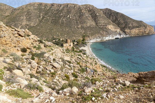 Castle, buildings and beach Cala de San Pedro, Cabo de Gata Natural Park, Nijar, Almeria, Spain, Europe