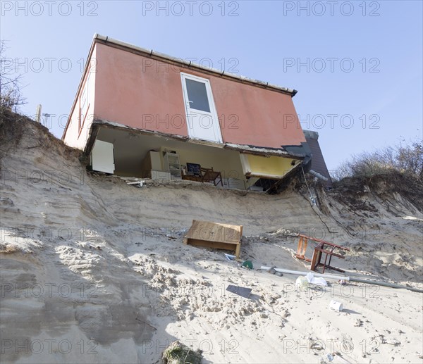 March 2018, Clifftop property collapsing due to coastal erosion after recent storm force winds, Hemsby, Norfolk, England, UK