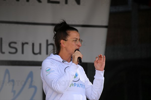 Karlsruhe: Tina Romdhani speaks about the situation of children, especially in schools, as part of the Corona protests against the measures taken by the federal government. The protests were organised by the Querdenken 721 Karlsruhe initiative